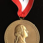 Photo image close up of the George Washington Book Prize medal won by Stephen Brumwell in 2013 for 'George Washington: Gentleman Warrior'.